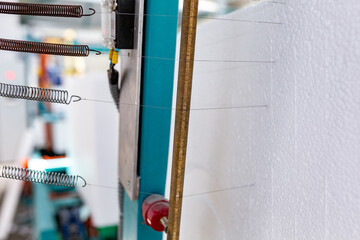 Industrial production of polystyrene foam insulation panels or plates. A large blocks of Styrofoam...