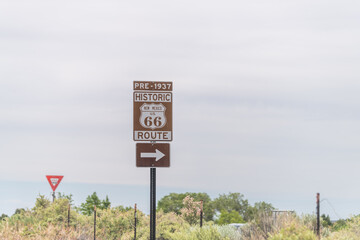 Santa Fe, USA Historic highway route 66 sign near city with pre 1937 text and arrow direction to...