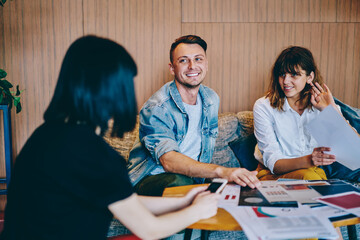 Cheerful Caucasian people in casual wear discussing plan strategy for design project enjoying business meeting, group of happy hipster guys 20s collaborating on creative ideas for new startup