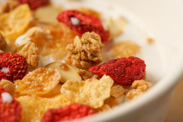 Bowl of Breakfast Cereal with strawberries, almonds and granola 