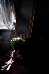 Wedding rings lie on a flower close up