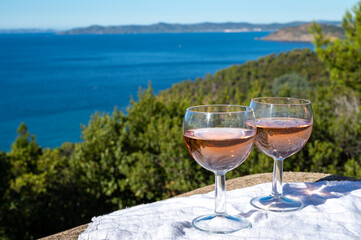 Picnic with of local rose wine and blue Mediterranean sea on background, near Saint-Tropez, Var, Provence, France
