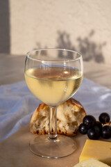 Tasting and pairing of cold white wine with different cheeses in sunny Provence, France