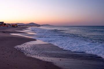 Fototapeta na wymiar Beautiful and colorful sunrise on the shores of the mediterranean sea