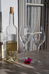 Tasting of local white wine on sunny summer balcony Provence, France