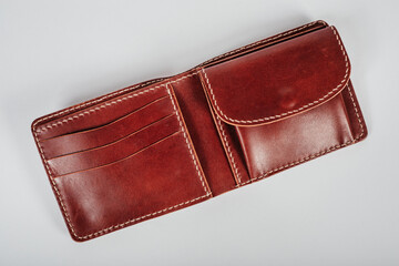 genuine leather wallet brown color on isolated white background.