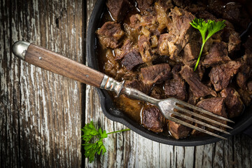 Beef stew in a cast iron skillet.