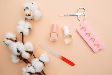 Fototapeta na wymiar Nail care. A set of professional tools for manicure and pedicure on pink background.