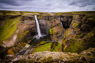 Obraz premium The photo shows beautiful Haifoss waterfall in the Iceland. It is the second largest waterfall in the Iceland.