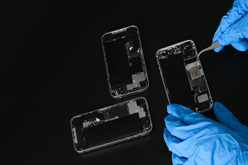 Technician repairing the Cell phone parts and tools for recovery repair phone smartphone and...