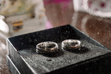 Two silver wedding rings. Close-up view of silver wedding rings in a box