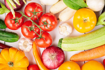 Organic fresh vegetables food background. Autumn vegetables and Thanksgiving day theme. Pumpkin, onions, carrots, tomatoes, mushrooms, cucumbers and other.