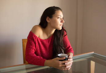 Young woman having brakefast meditating