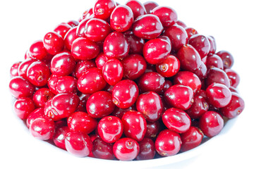 Red cherries close up on a white background