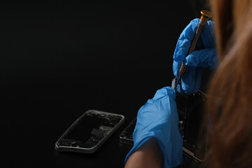 Technician repairing the Cell phone parts and tools for recovery repair phone smartphone and...