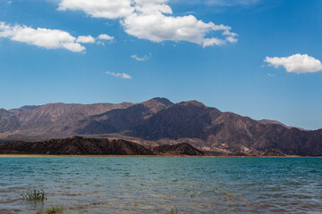 Fototapeta na wymiar Wonderful Potrerillos Mountains in front of lake.