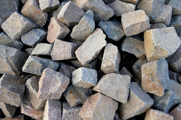 Texture of many coloured large stones, background wallpaper