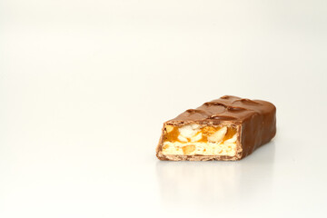 chocolate bar with nuts, a chocolate bar trimmed on one side to show the filling