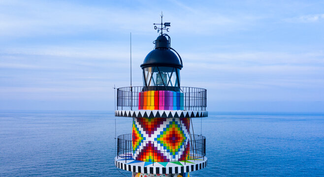 Cabo de Ajo Lighthouse painted by the painter Okuda San Miguel, specialized in Urban Art. Ajo, Bareyo Municipality, Cantabria, Cantabrian Sea, Spain, Europe