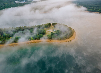 An aerial view of summary foggy morning in lakes and islands