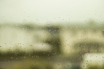 Beautiful view of raindrops running on window glass. Beautiful nature backgrounds.