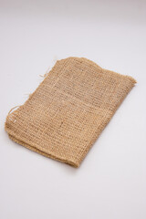 pieces of gunny sack against an isolated white background