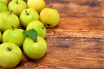green apples on wooden background copy space