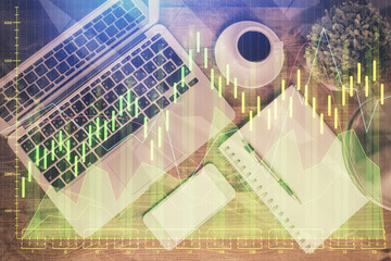 Fototapeta na wymiar Financial market graph and top view computer on the desktop background. Double exposure. Investment concept.