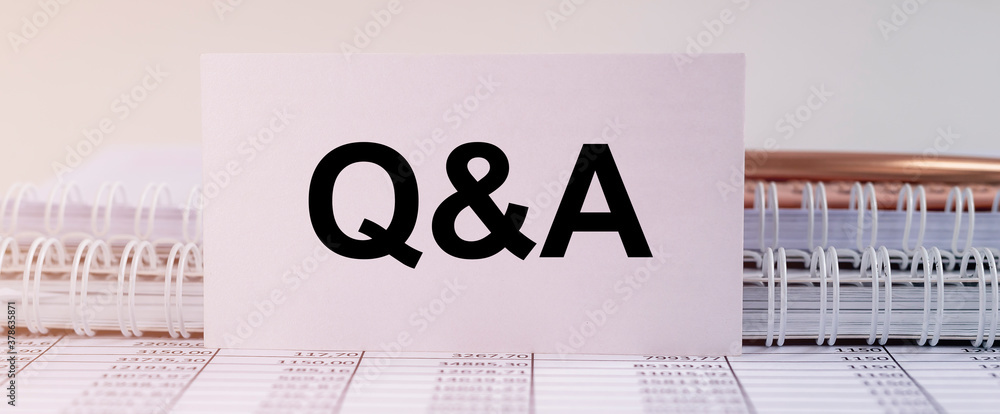 Poster q and a - questions and answers text sign on business white card on office table