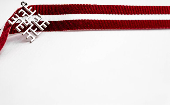 Friendship bracelets in the colours of the Latvian flag