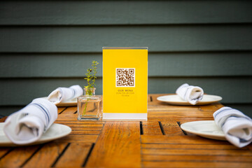 QR code used for safely viewing menu at a restaurant. - obrazy, fototapety, plakaty