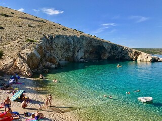Koromacno, Island Cres July 2018. Koromacno, one of the most famous beach on the island. Croatian beach during summer, full of tourist. - obrazy, fototapety, plakaty