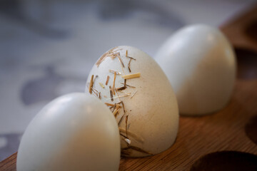 Three Freshly Laid Hens Eggs in Wooden Holder