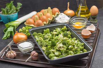 Mix broccoli and Brussels sprouts in food metal pallet.