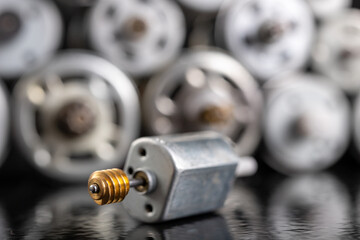 Small electric motor with worm gear. Electric accessories for repairing power tools.