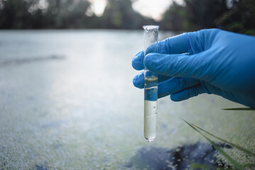 A water pollution sample in the test tube close up.
