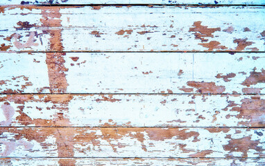 Old wood background with peeling white paint.