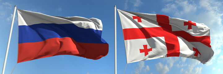Flying flags of Russia and Georgia on high flagpoles. 3d rendering