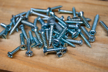 pile of screws on wood