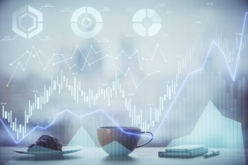 Double exposure of forex chart over coffee cup background in office. Concept of financial analysis...
