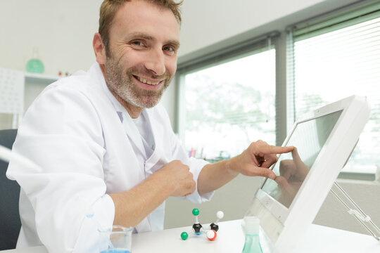 man doctor interacting with medical interface - Powered by Adobe