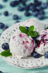 blueberry ice cream on turquoise surface