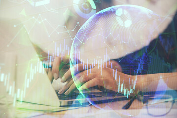 Multi exposure of woman hands typing on computer and financial graph hologram drawing. Stock market analysis concept.