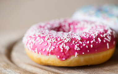 Unhealthy eating, junk food concept, pink donut with copy space