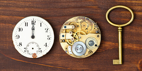 Watch and clockwork with gold key, time management or deadline, countdown concept. Web banner.