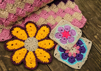 Obraz na płótnie Canvas knitted fabric with flowers