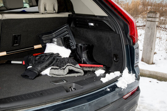 winter emergency automobile kit, hat, gloves, scarf, boots in the trunk
