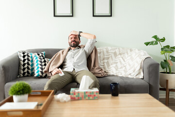 Fototapeta premium Man with fever suffering at home