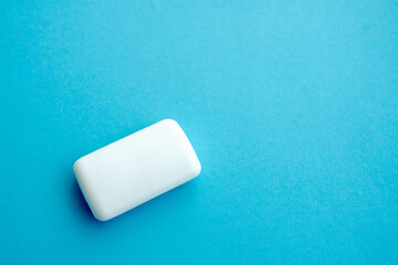white soap, isolated on blue copy space background. flat lay.Top view.