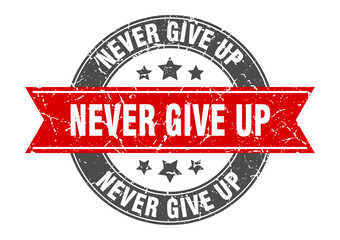 Obraz premium never give up round stamp with ribbon. label sign